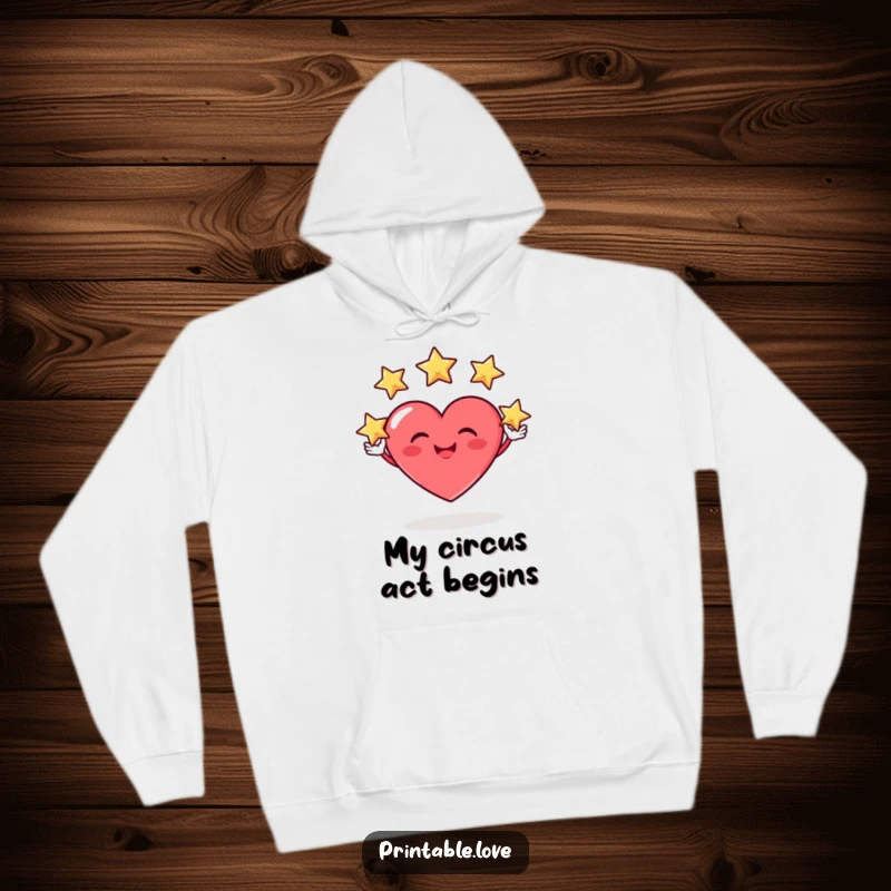Funny hoodie design with a heart character sporting a silly grin while skillfully juggling three tiny, sparkling stars with playful ease.