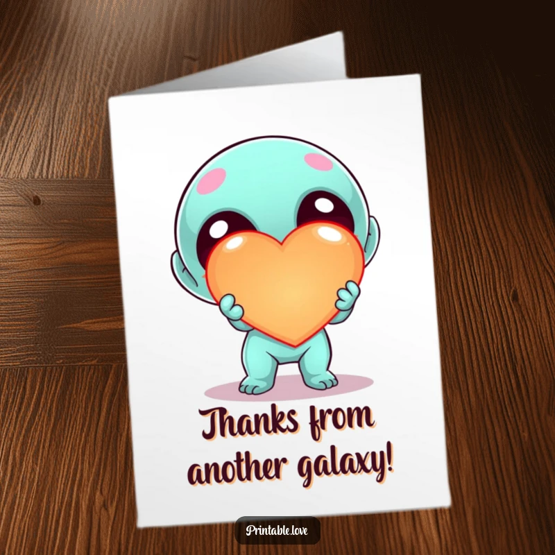 Funny Free Printable Alien Thank You Card depicting a kawaii alien enthusiastically offering a large, glowing heart, perfect for expressing thanks.
